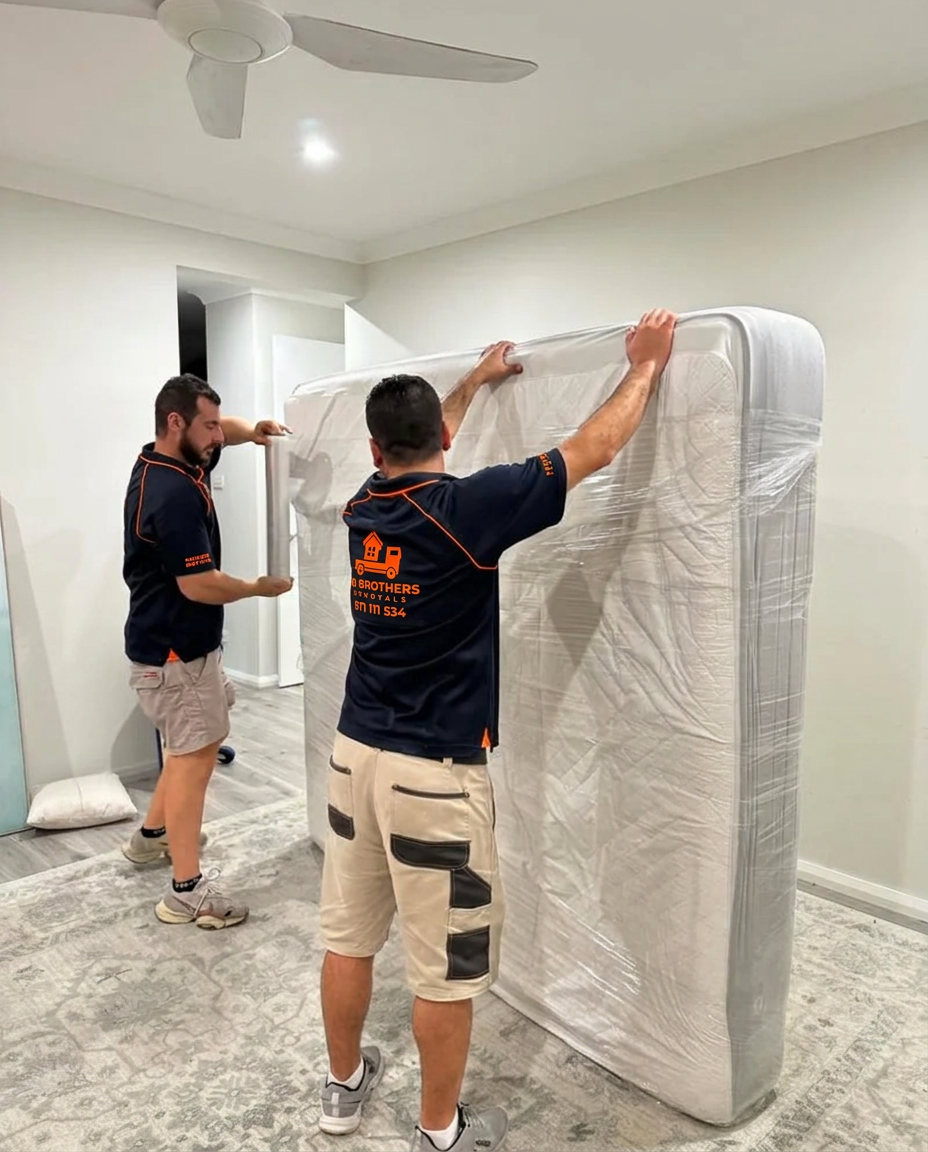 Wrapping a mattress in a protective cover before it goes on the truck
